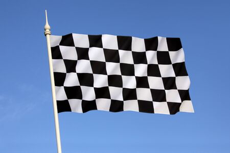 Checkered Flag - traditionally used in auto racing and similar motorsports to indicate the end of a race. The first past the chequered flag is the winner of the race.の写真素材