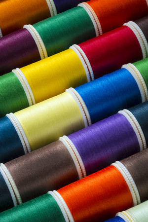 Selection of colored cotton threads used in sewing