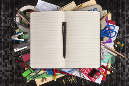 Selection of stationery for the office or for going back to school or college - Open book with space for text.の写真素材