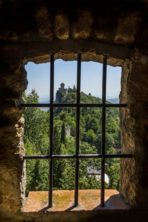 View from a window in the fortress of Guaita on Mount Titano in San Marino. The Republic of San Marino is an enclaved microstate surrounded by Italy. San Marino claims to be the oldest sovereign state and constitutional republic in the world - founded on のeditorial素材