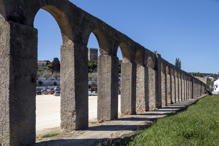 Ancient aqueduct in the medieval walled town of Obidos in the Oeste region of Portugal.のeditorial素材