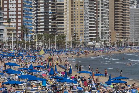 Crowds of Holidaymakers in Benidorm - Spain.  A city in the province of Alicante on the Costa Blanca in eastern Spain, on the Mediterranean coast.のeditorial素材