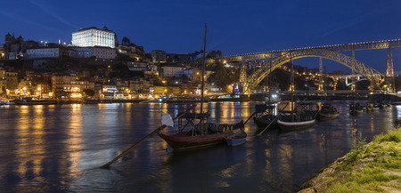 Night view of the city of Oporto (or Porto) in Portugal. Porto is one of the oldest European ports, and its historical centre was proclaimed a World Heritage Site by UNESCO in 1996. One of Portugal's internationally famous exports, port wine, is named aftの写真素材