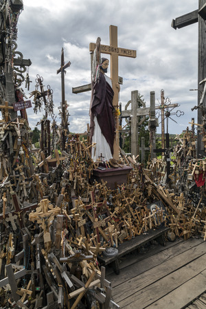 The Hill of Crosses - a site of pilgrimage in northern Lithuania. Over the generations, crosses, crucifixes, statues of the Virgin Mary and thousands of tiny effigies and rosaries have been placed here by Catholic pilgrims.のeditorial素材