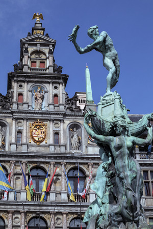 Antwerp - Belgium. Statue of Silvius Brabo throwing the giants hand in front of the Stadhuis (City Hall) of Antwerp in the Grote Markt.のeditorial素材