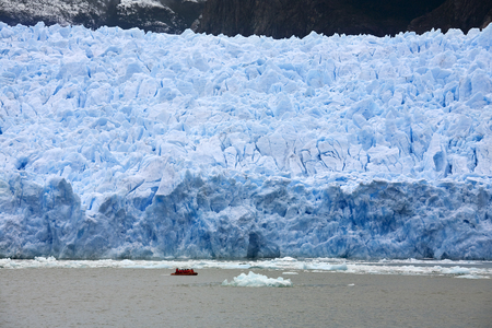 Adventure tourists near the San Rafael Glacier in the Laguna San Rafael National Park in the Northern Patagonian Ice Field in southern Chile, South America.の写真素材