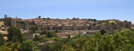 The medieval city walls and the city of Avila in the Castilla-y-Leon region of central Spain.の写真素材