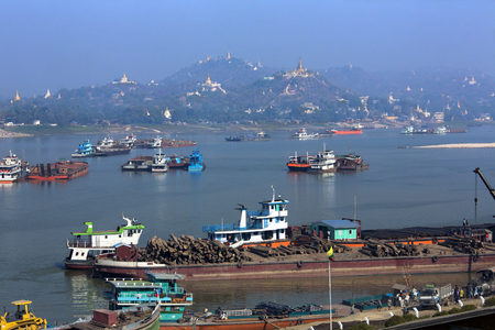 River traffic of the busy Irrawaddy River and city of Sagaing in Myanmar (Burma).のeditorial素材