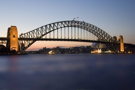 Sydney Harbor Bridge in Sydney Harbor, New South Wales, Australia. Opened in 1932, it carries rail,...