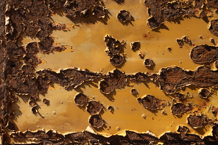 Peeling paint on a rusty old metal tank