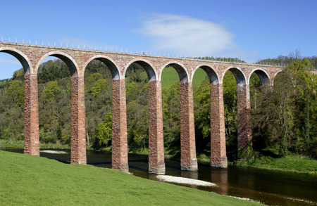 Viaduct near Melrose in Scotland. A viaduct is a bridge composed of several small spans for crossing a valley, this one carries a railway line.の写真素材