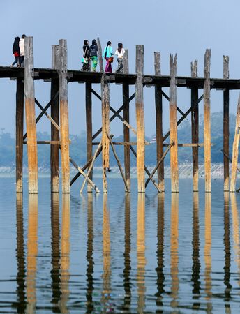 Amarapura. Myanmar. 01.29.13. U-Bein Bridge at Amarapura near Mandalay in Myanmar (Burma). The footbridge, over Taungthaman Lake, was constructed in 1849 using reclaimed teak columns by the then mayor of Amarapura, U Bein.のeditorial素材