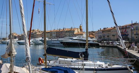 Luxury yachts moored in the harbor of the resort of St Tropez on the Cote d'Azur in the South of France.のeditorial素材