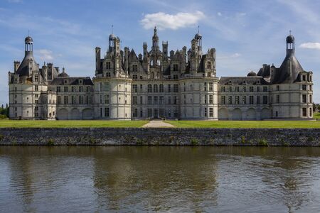 Chateau de Chambord with the River Cosson in the foreground in the Loire Valley in France. The 440 room chateau dates from 1519 and is the largest in the Loire. UNESCO World Heritage Site.のeditorial素材