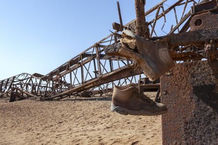 Abandoned Engineering - Rusting infrastructure of an old oil rig on the Skeleton Coast in Namibia,...