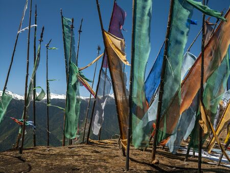 Buddhist prayer flags high in the Himalayan Mountains in the Kingdom of Bhutan.の写真素材