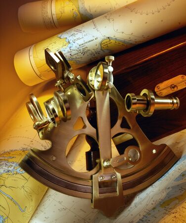 Sextant - a doubly reflecting navigation instrument that measures the angular distance between two visible objects. The primary use of a sextant is to measure the angle between an astronomical object and the horizon for the purposes of celestial navigationの写真素材