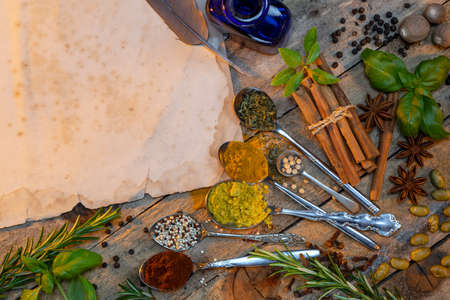 Cooking spices and herbs with space for text on vintage paper.の写真素材