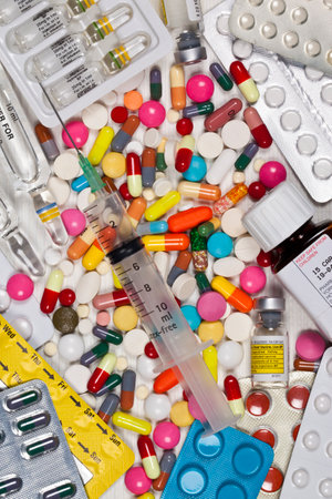 United Kingdom. 04.13.11. Pills, tablets capsules and a syringe used by the medical profession in the treatment of illness.のeditorial素材