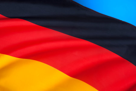 The flag of Germany. Since reunification on 3 October 1990, the black-red-gold tricolour has become the flag of reunified Germany.の写真素材