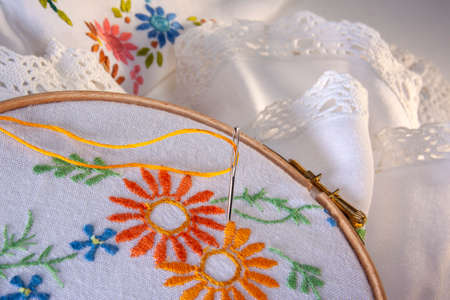 Embroidery or Needlepoint - the craft of decorating fabric or other materials using a needle to...