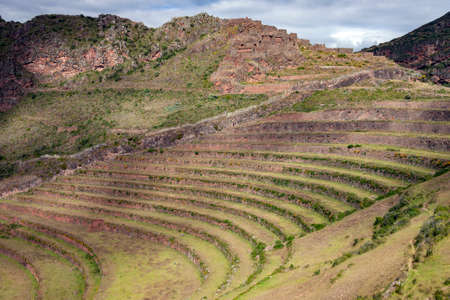 The Inca terraces and ruins of Qantus Raqay in the Sacred Valley of the Incas in Peru, South America.の写真素材