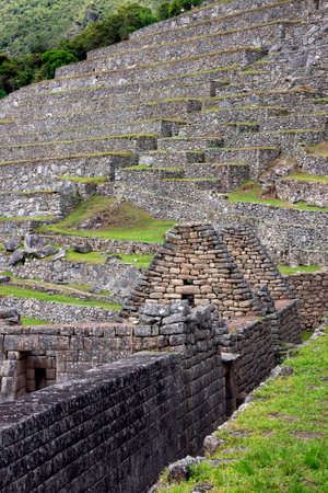 The Inca city of Machu Picchu in Peru, South America. Although known locally, it was not known to the Spanish during the colonial period and was unknown to the outside world until American historian Hiram Bingham brought it to international attention in 1のeditorial素材
