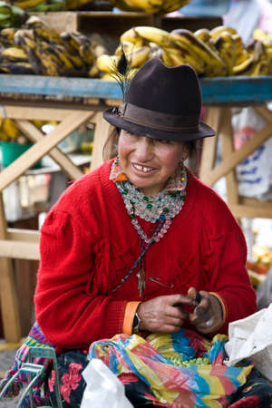 Ecuadorian woman on a market in the village of Saquisili in the Avenue of the Volcanos in the Cotopaxi region of Ecuador, South America.のeditorial素材