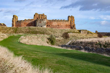 Tantallon Castle near North Berwick, in East Lothian, Scotland. This ruined mid-14th-century fortresss. It sits on a promontory opposite Bass Rock, looking out onto the Firth of Forth. Built circa .1350の写真素材
