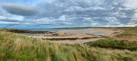 Sandside Beach near the Vulcan Naval Nuclear Reactor Test Establishment at Dounreay in Caithness on the north coast of Scotland. The beach has Radioactive contamination from the nearby nuclear plant (visible in the distance).の写真素材