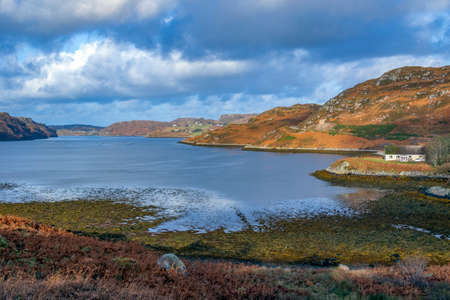 Low tide at the southern end of Loch Inchard near Rhiconich on the northwest coast of Scotland.の写真素材