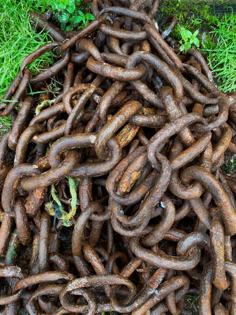 Corrosion - pile of rusty old chainsの写真素材