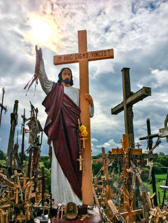 The Hill of Crosses - a site of pilgrimage in northern Lithuania. Over the generations, crosses, crucifixes, statues of the Virgin Mary and thousands of tiny effigies and rosaries have been placed here by Catholic pilgrims.の写真素材