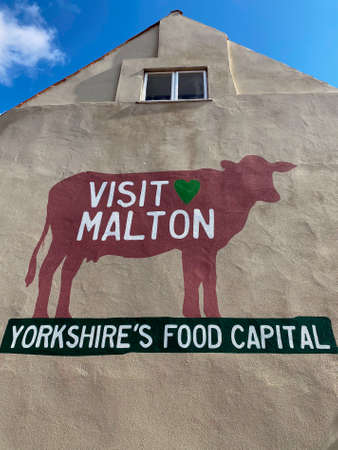 Malton - Yorkshires Food Capital - on a wall in the market town of Malton in North Yorkshire, United...