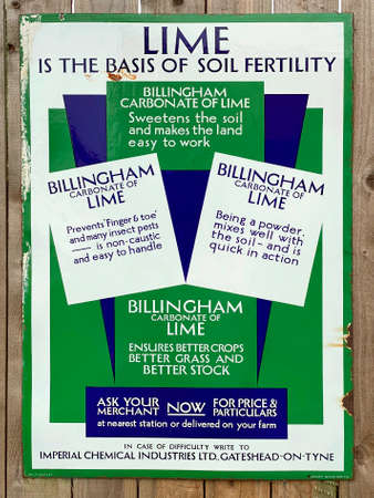 Old metal 1950âs agricultural advertising sign at the Beamish Open Air Museum in Northumberland in northeast England.のeditorial素材