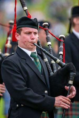 Piper at the Cowal Gathering Highland Games near Dunoon on the Cowal Peninsula, Scotland.のeditorial素材