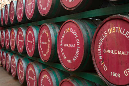 Wooden whiskey barrels at the Bushmills Distillery in County Antrim, Northern Ireland.のeditorial素材