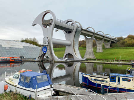 The Falkirk Wheel - a rotating boat lift in Falkirk, central Scotland, connecting the Forth and Clyde Canal with the Union Canal. It reconnects the two canals for the first time since the 1930s. It opened in 2002 as part of the Millennium Link project.のeditorial素材
