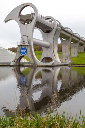 The Falkirk Wheel - a rotating boat lift in Falkirk, central Scotland, connecting the Forth and Clyde Canal with the Union Canal. It reconnects the two canals for the first time since the 1930s. It opened in 2002 as part of the Millennium Link project.のeditorial素材