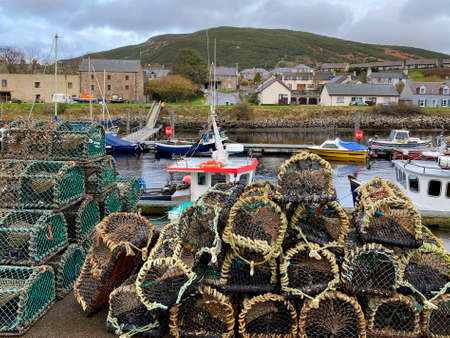Lobster pots in the harbor in the coastal village of Helmsdale in Sutherland on the east coast of Scotland.のeditorial素材