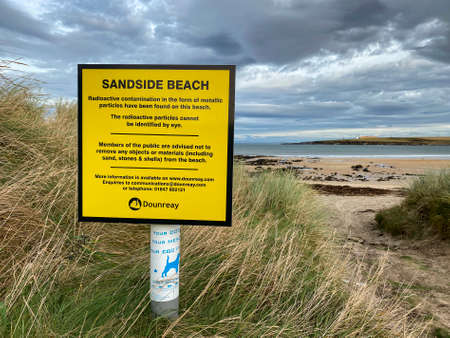Radioactive contamination warning sign at Sandside Beach near the Vulcan Naval Nuclear Reactor Test Establishment at Dounreay in Caithness on the north coast of Scotland. It is a test site for the development of prototype fast breeder reactors and for subのeditorial素材