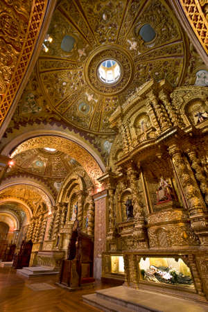 Part of the interior of La Compania Jesuit Church in Quito in Ecuador in South America. Much of the ornate sculpture is made from local volcanic pumice which has then been covered in gold leaf (supposedly 7 tons of it)のeditorial素材