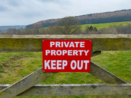 Sign on a wooden gate - Private Property - Keep Outの写真素材