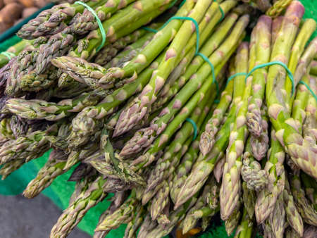 Asparagus (Asparagus officinalis) for sale on a market stall. Widely cultivated as a vegetable crop.の写真素材