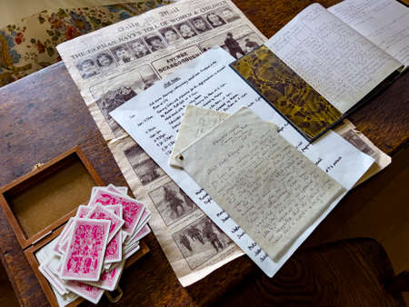 Newspaper dated Dec. 1914 with letters and ledgers on an antique desk in Dunham Massey Hall. Northwest England.のeditorial素材