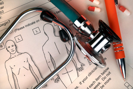 Medicine - Stethoscope and clinicians notes on a doctors desk.の写真素材