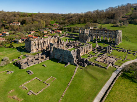 Aerial view of the ruins of Rievaulx Abbey naer Helmsley in North Yorkshire in the northeast of England. It was one of the great abbeys in England until it was seized in 1538 under Henry VIII during the Dissolution of the Monasteries. Dates from circa 1130.の写真素材