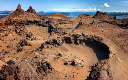 Cinder cones and craters in the ancient volcanic landscape on the island of Bartolome in the Galapagos Islands, Ecuador.の写真素材