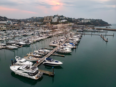 Aerial view at dusk of the harbor and marina in Torquay on the English Riviera on the south coast of Devon in the United Kingdom.の写真素材