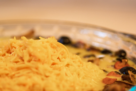 Cheese, egg and Vegetable mixture in glass baking dish.の写真素材
